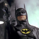 Michael Keaton's Batman raises the his grappling hook launcher in a scene from Tim Burton's 1989 classic.